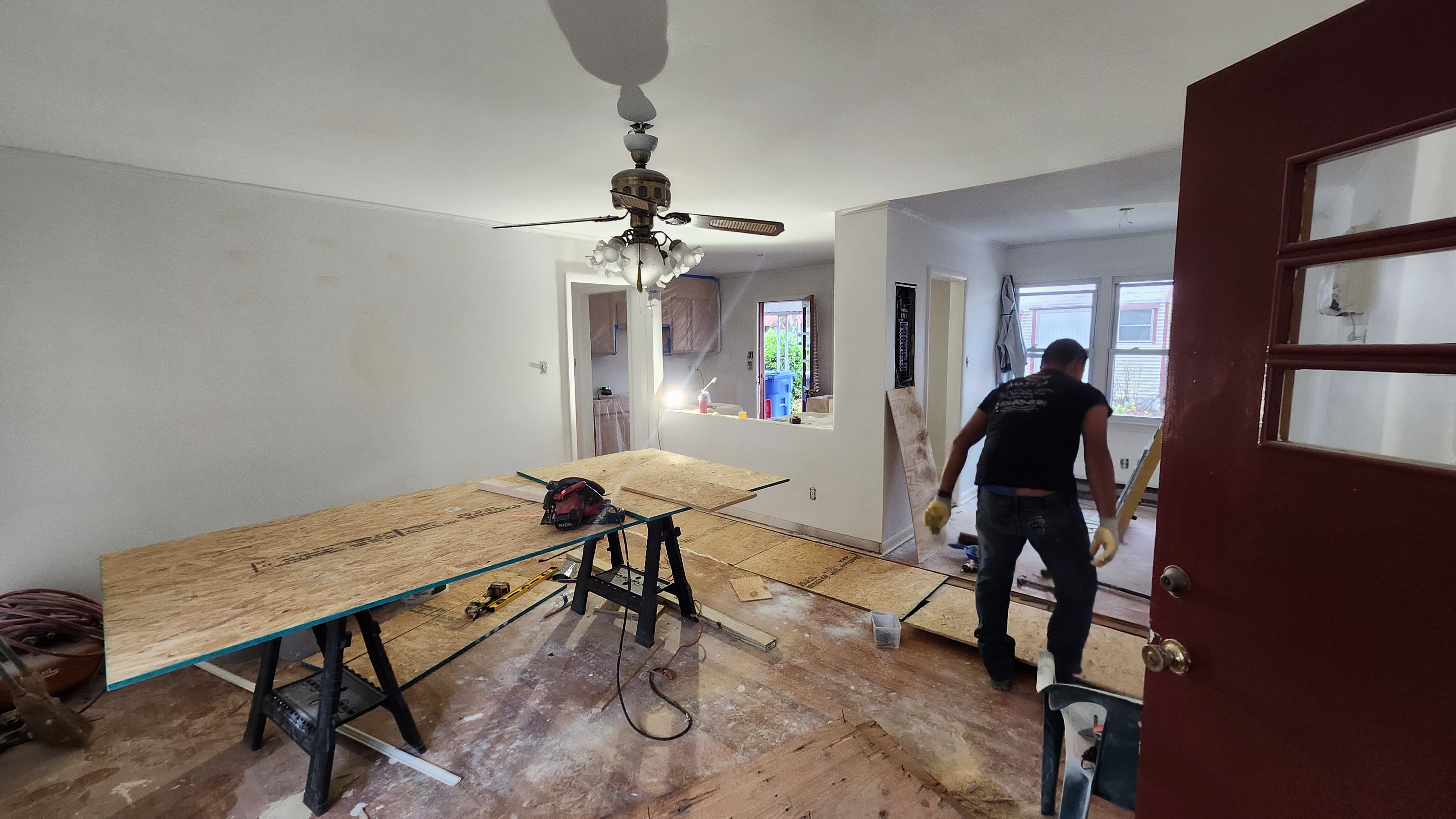 Living room showing flooring renovation in progress
